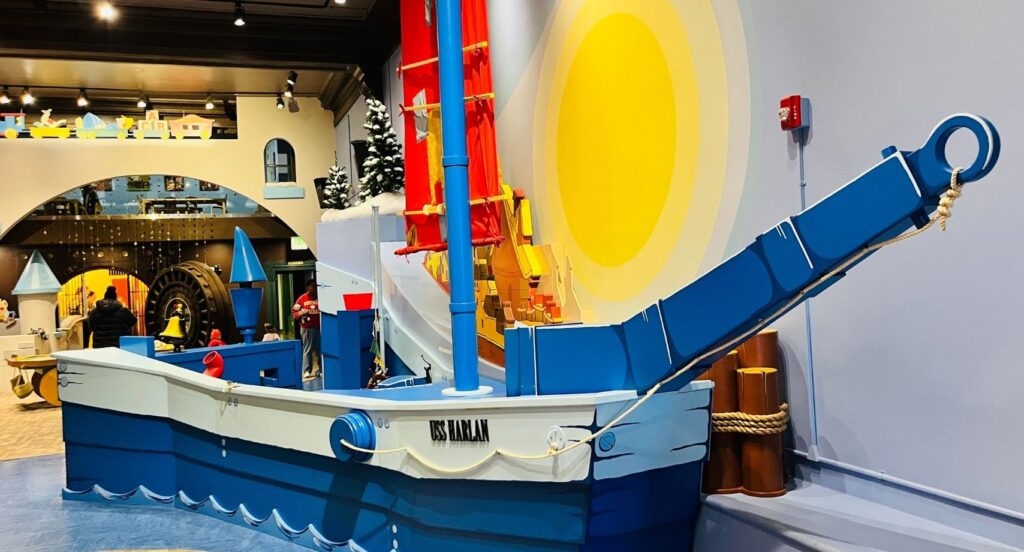 Main Street Children's Museum in Rock Hill offers a Sailboat exhibit with a small brown boat and a large walk-in blue sailboat.