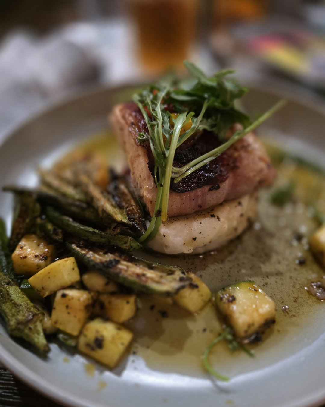 Elegantly plated protein dish with roasted okra and squash at Kounter Rock Hill SC