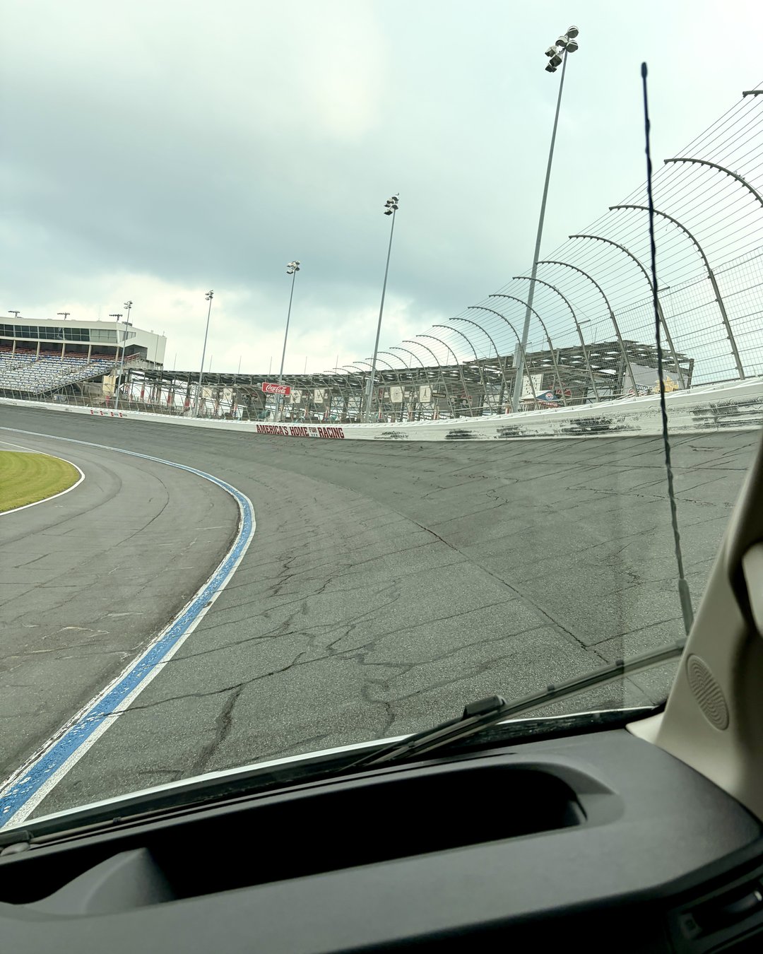 Tour van riding the 24-degree banking on the oval at Charlotte Motor Speedway